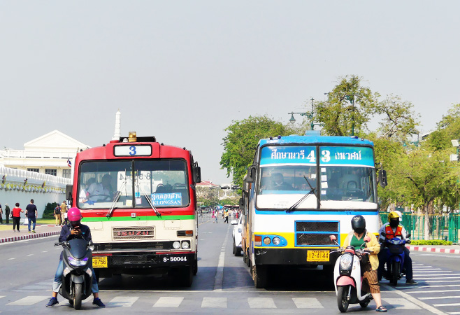 Busses waiting for the green light in front of the Grand Palace.